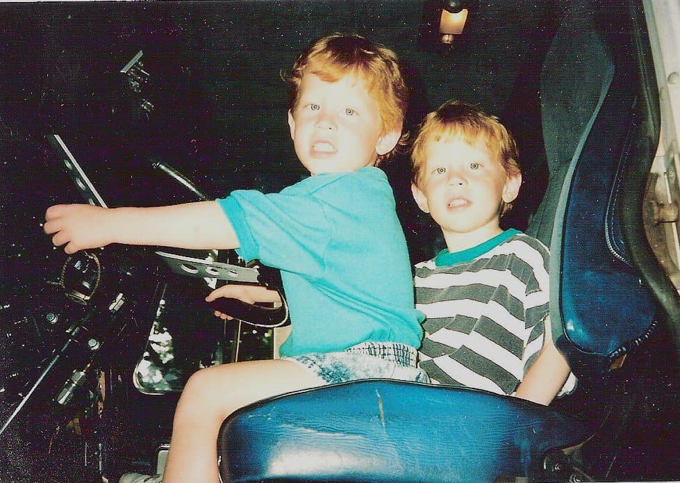 Matt Convente and Mike Convente at around age four in their Dad's 18 wheeler truck cab.